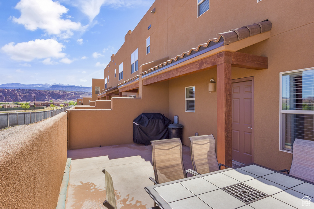 View of patio / terrace featuring a mountain view and outdoor dining space