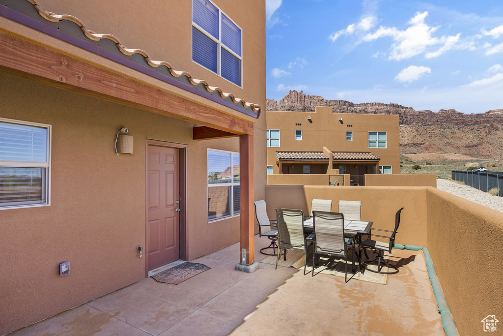 View of patio / terrace with outdoor dining area and a mountain view
