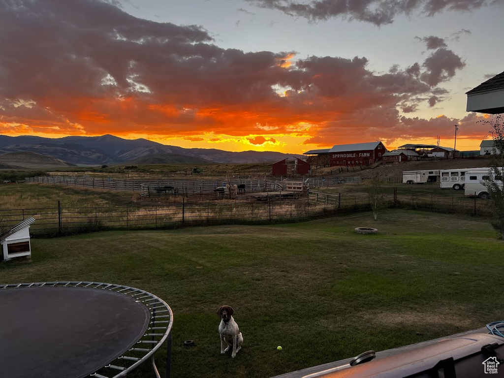 Yard at dusk with a mountain view