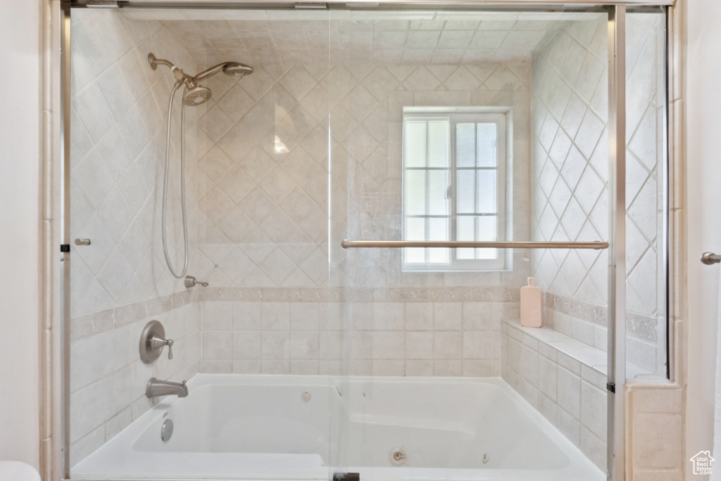 Full bathroom featuring a combined bath / shower with jetted tub