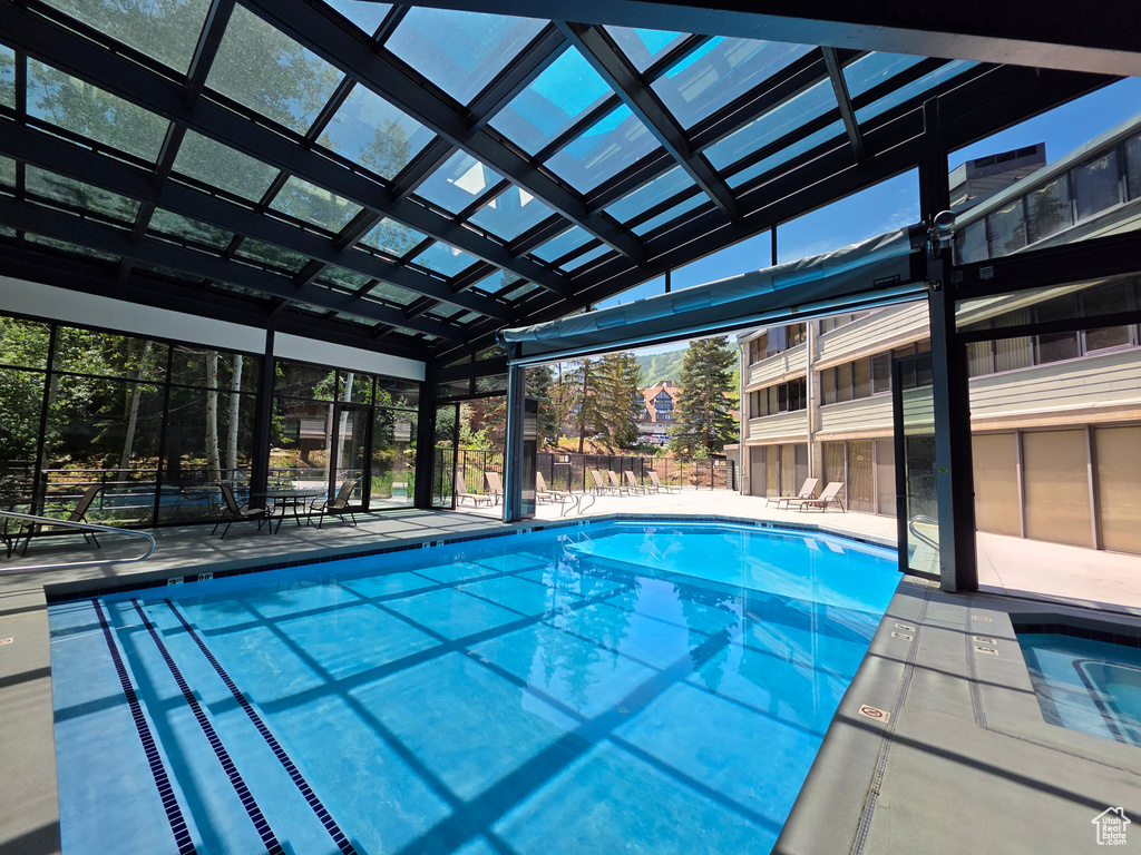 Indoor pool with a patio area