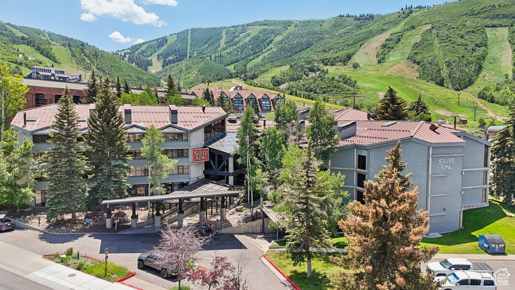 Aerial perspective of suburban area with a mountainous background