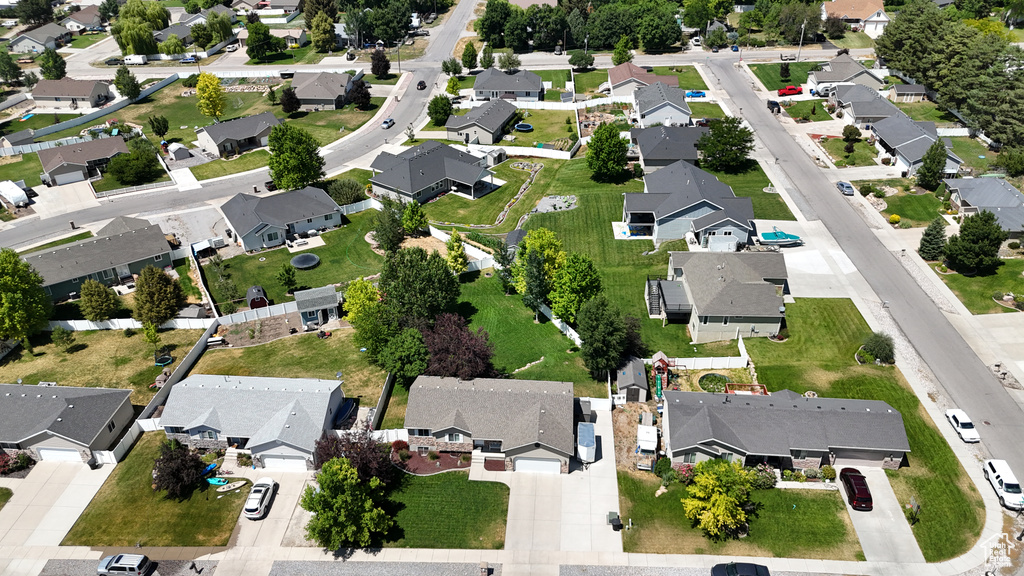 Aerial view of property and surrounding area with nearby suburban area