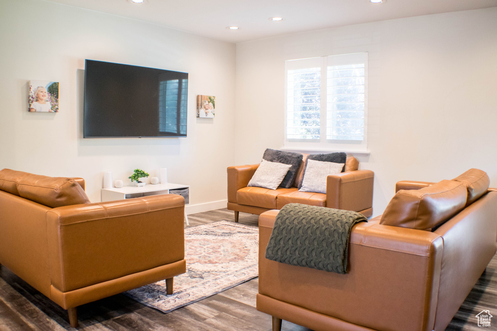 Living room featuring wood finished floors and recessed lighting