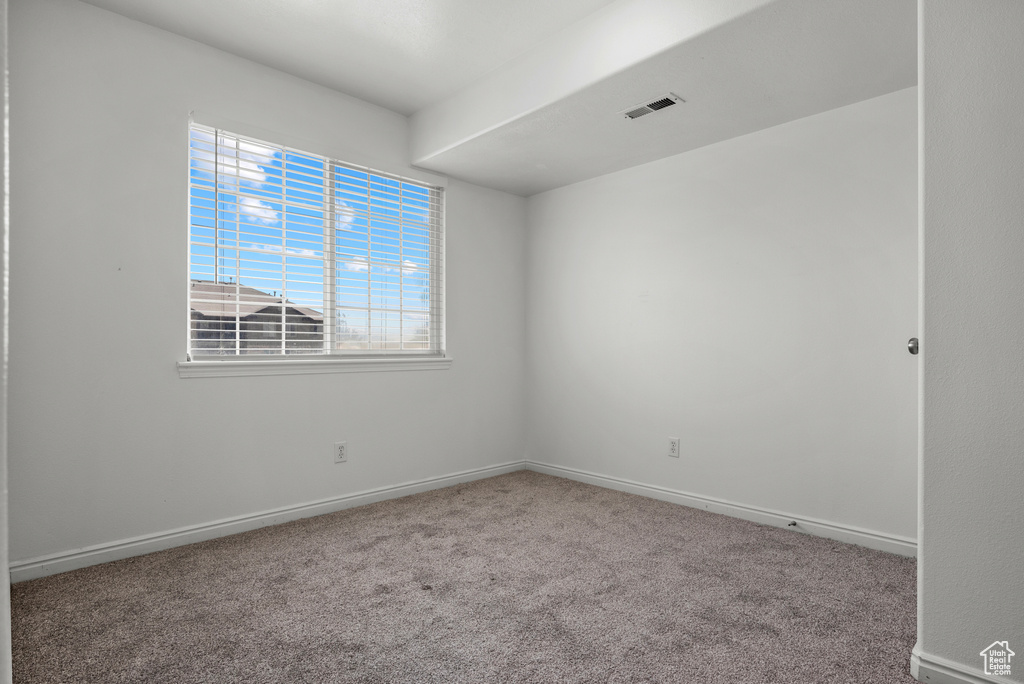 Spare room with carpet flooring and baseboards