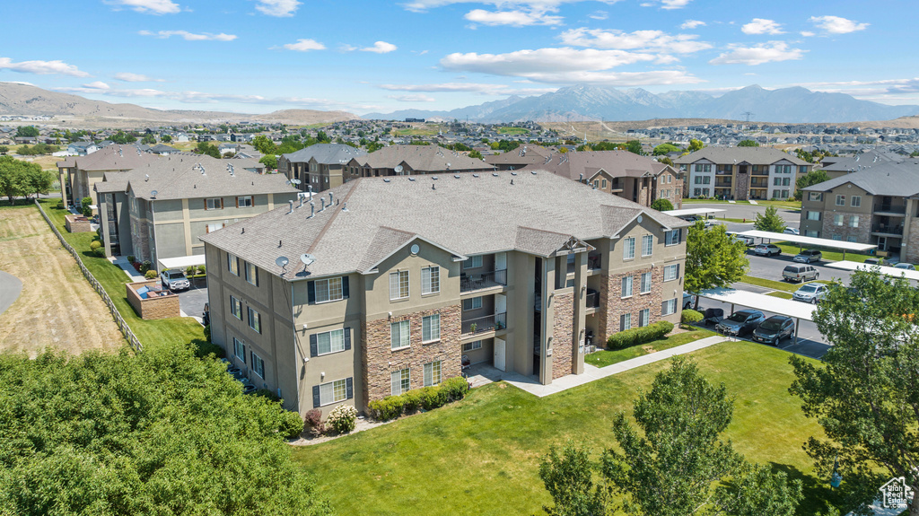 Aerial view of residential area featuring a mountain backdrop