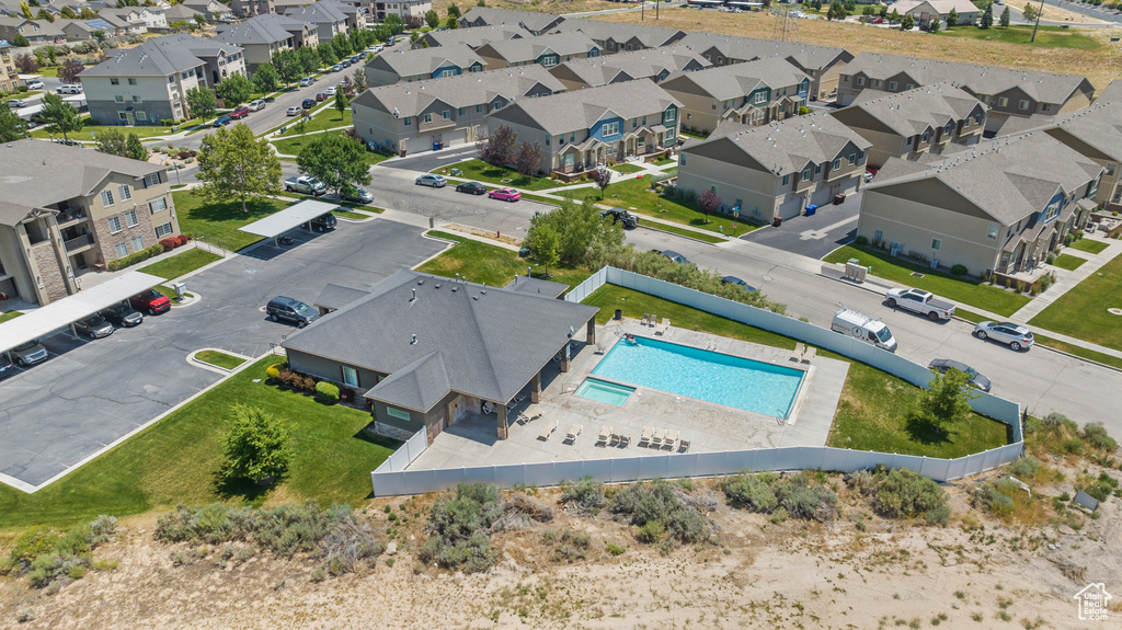 Aerial view of residential area featuring a pool area