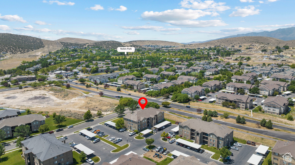 View of property location featuring mountains and nearby suburban area