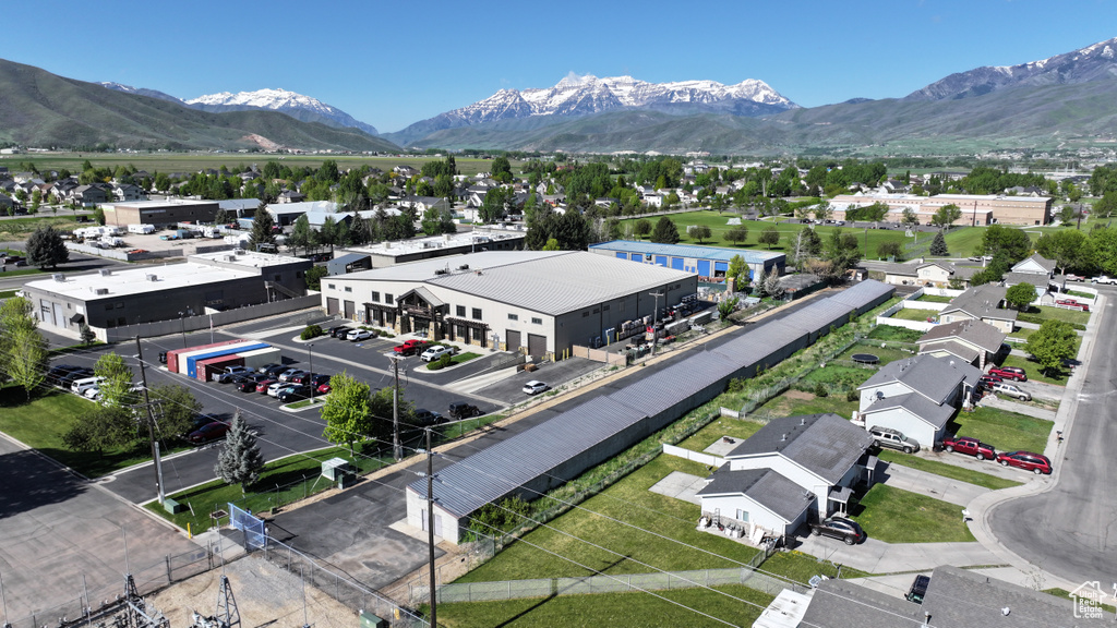 Aerial perspective of suburban area with a mountain backdrop