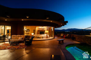 Outdoor pool featuring outdoor lounge area, a patio area, and a mountain view