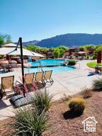 Community pool with a mountain view