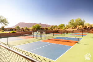 View of tennis court featuring community basketball court and a mountain view