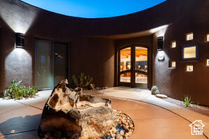 Entrance to property featuring stucco siding