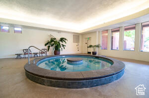 View of pool featuring a hot tub