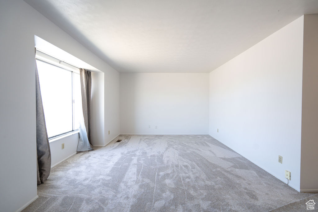 Empty room featuring carpet flooring