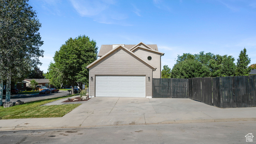 View of side of home with driveway