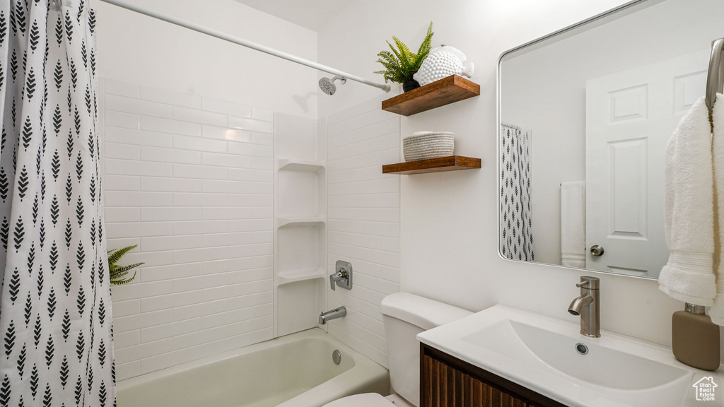 Bathroom featuring vanity and shower / tub combo