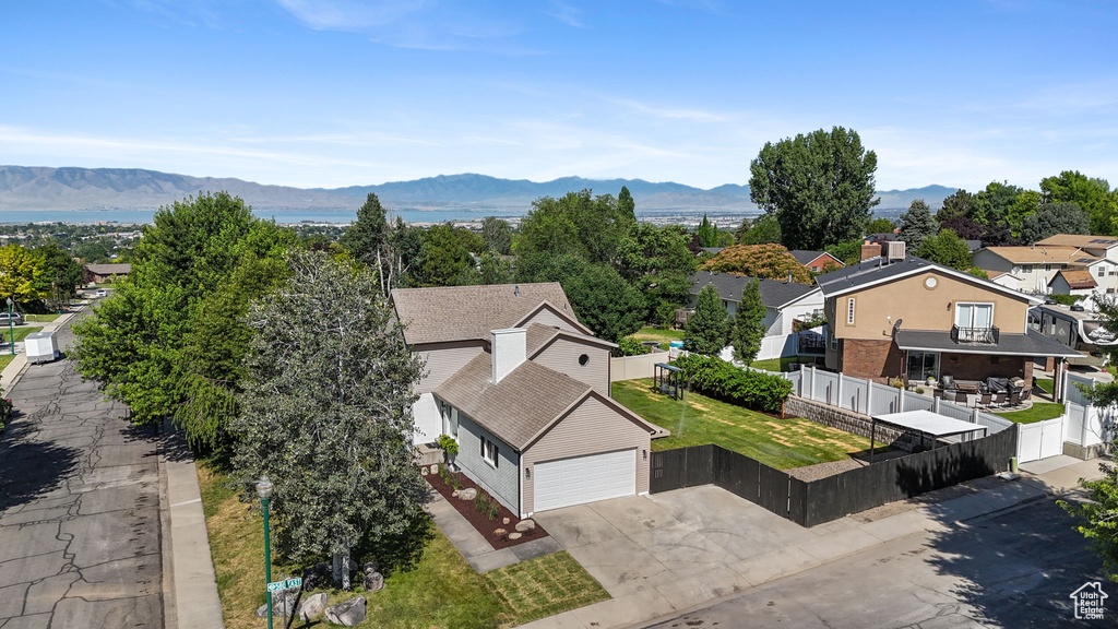 Aerial view of residential area featuring a mountain backdrop