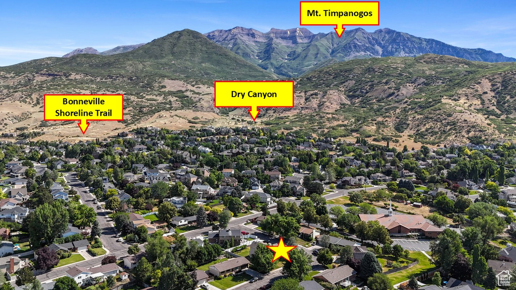 Aerial view of property's location with a mountain backdrop