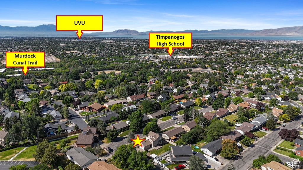 Aerial view of property's location with a mountain backdrop
