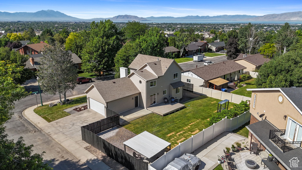 Aerial perspective of suburban area with a mountainous background