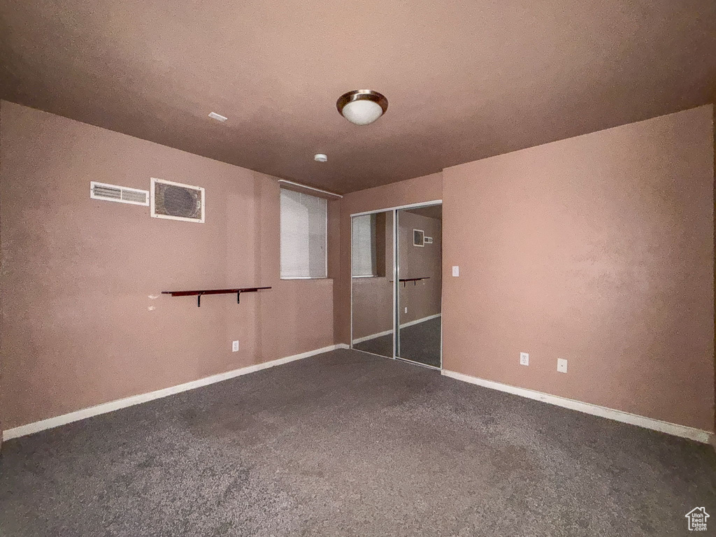 Unfurnished bedroom with carpet flooring and a closet