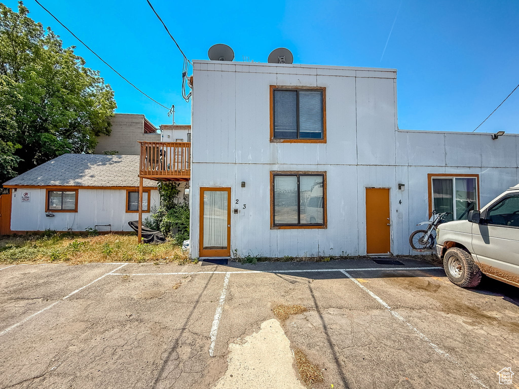 View of front of home featuring uncovered parking