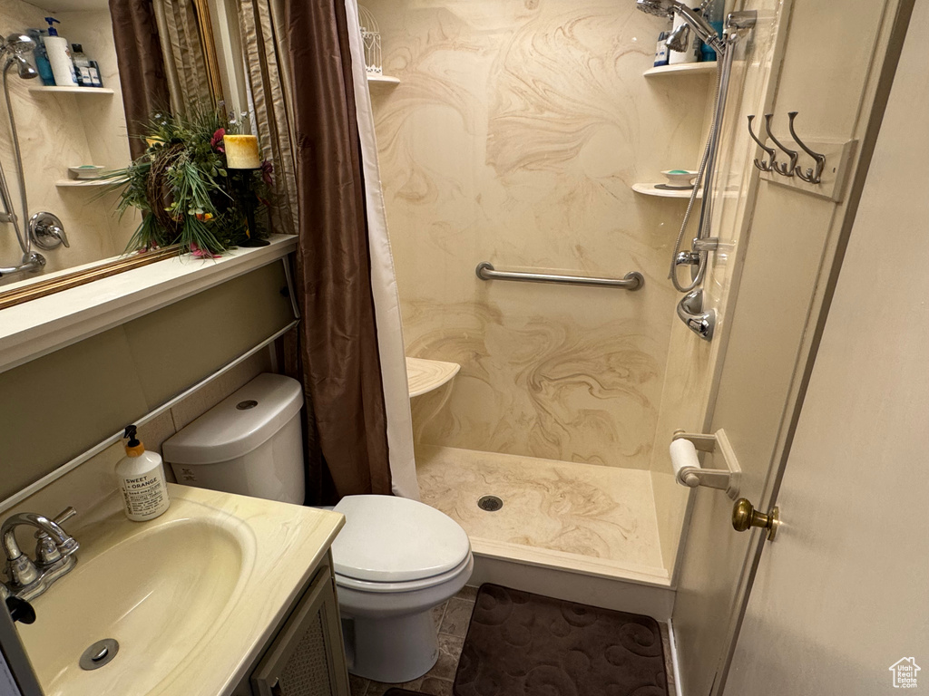 Full bath with vanity and a shower with curtain