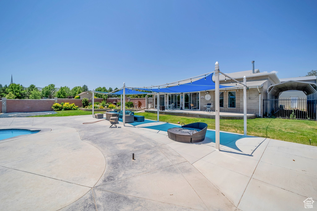 View of swimming pool with a fenced backyard and a patio area