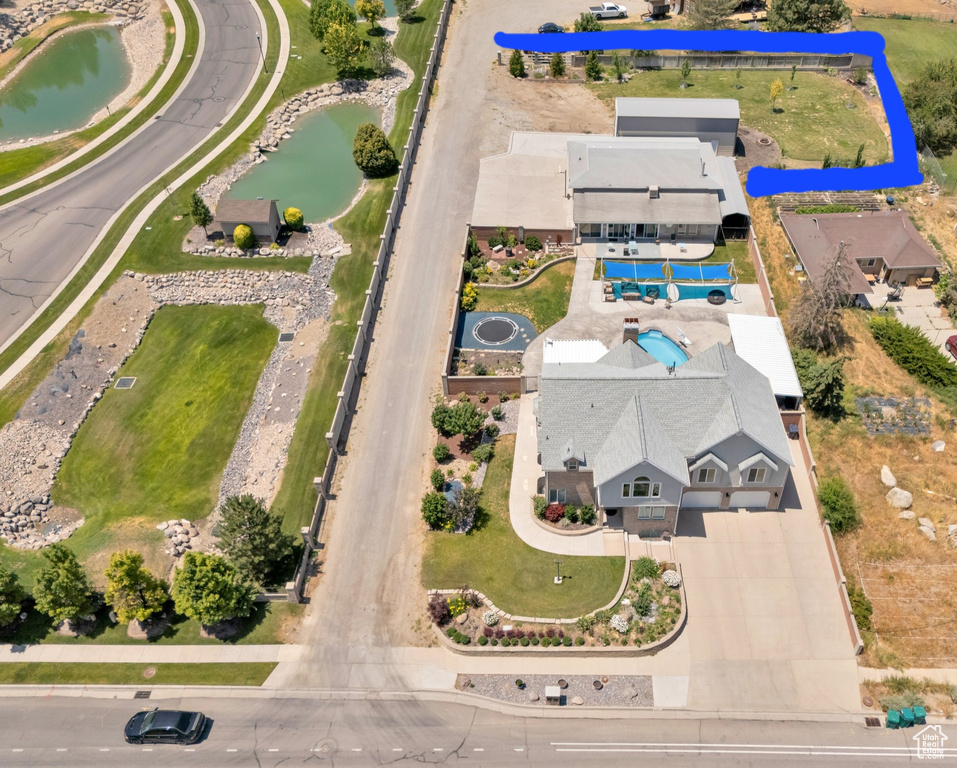 Aerial overview of property's location featuring a large body of water and property parcel outlined