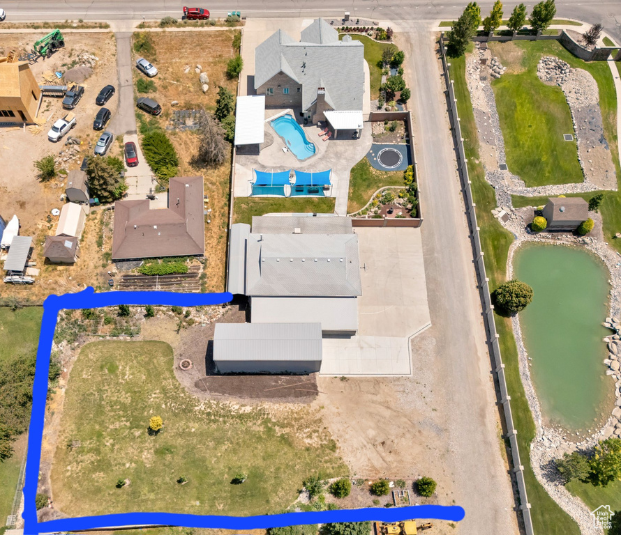 Aerial view of property's location with a large body of water and property boundaries highlighted
