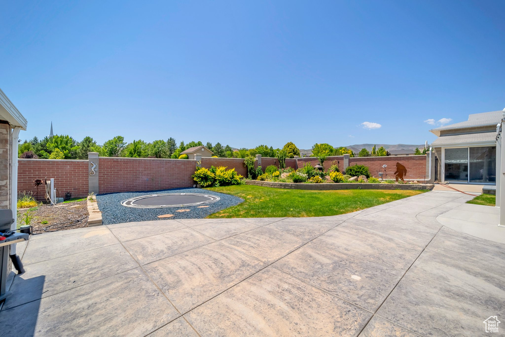 Fenced backyard featuring a patio area