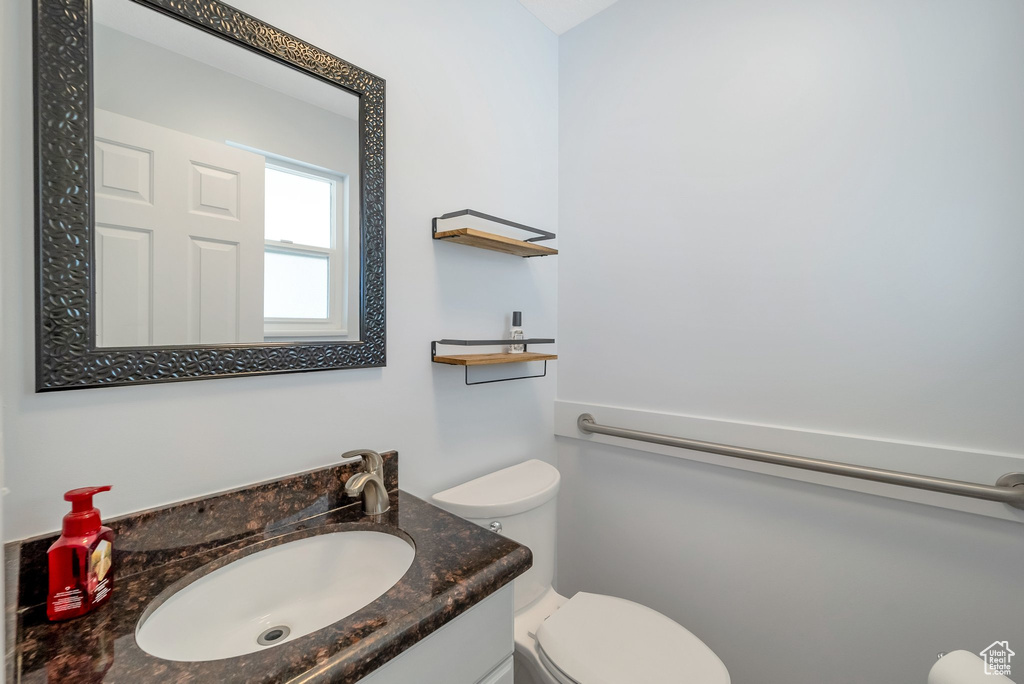 Bathroom with vanity and toilet