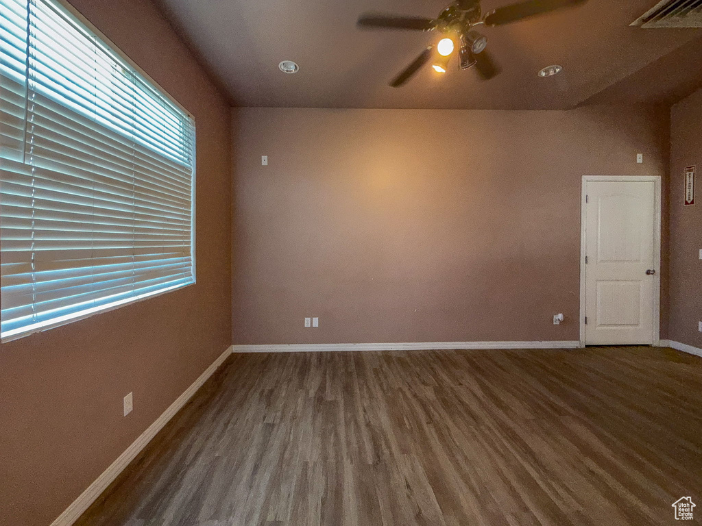 Empty room featuring wood finished floors and ceiling fan