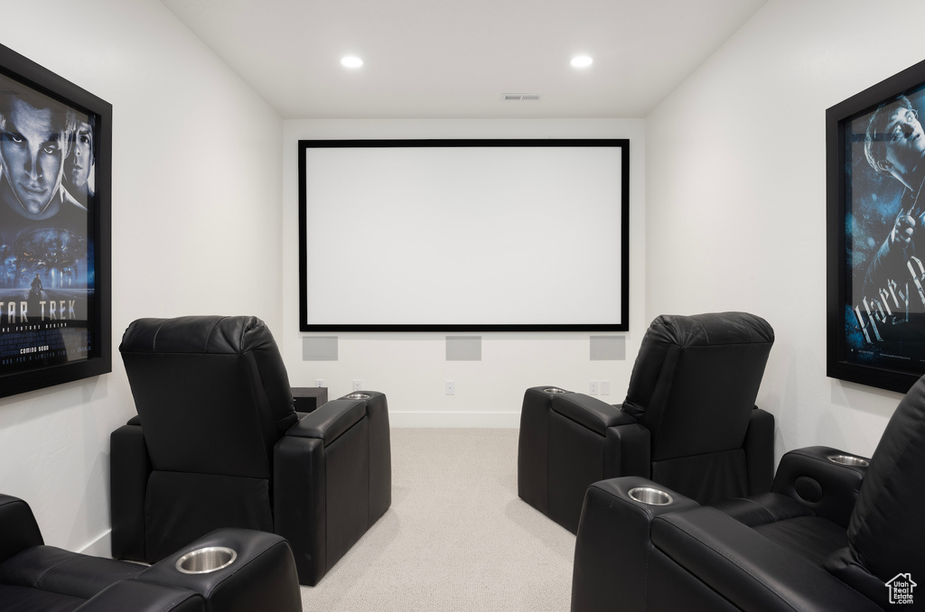 Cinema room with carpet floors and recessed lighting