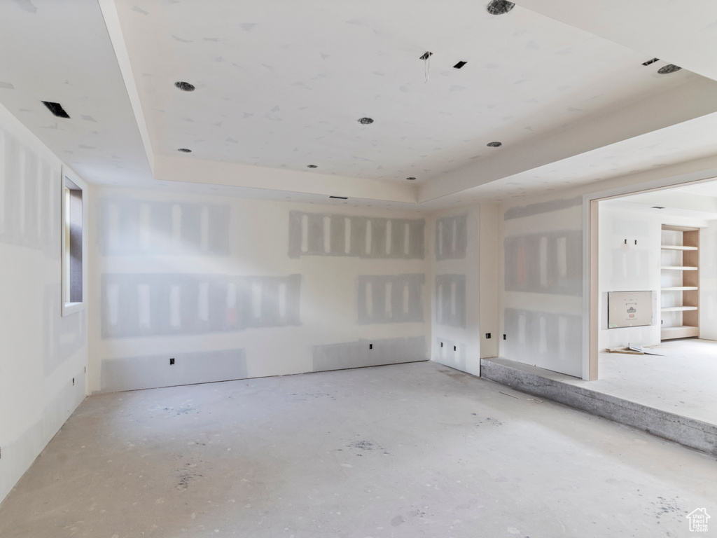 Unfurnished room featuring a raised ceiling