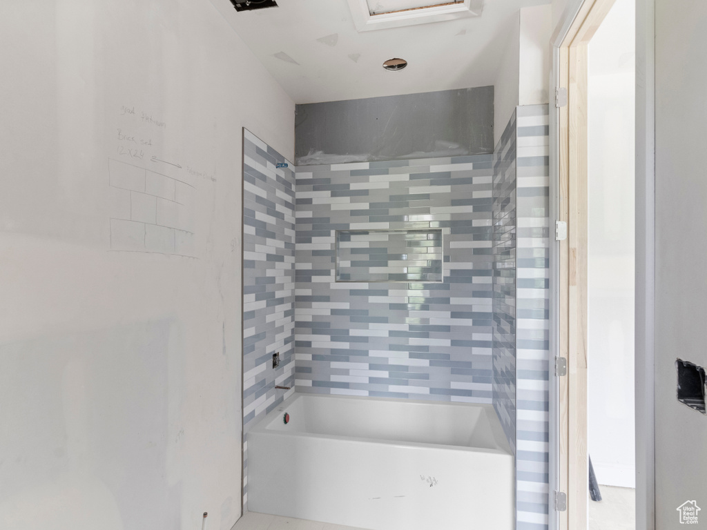 Full bathroom with shower / tub combination
