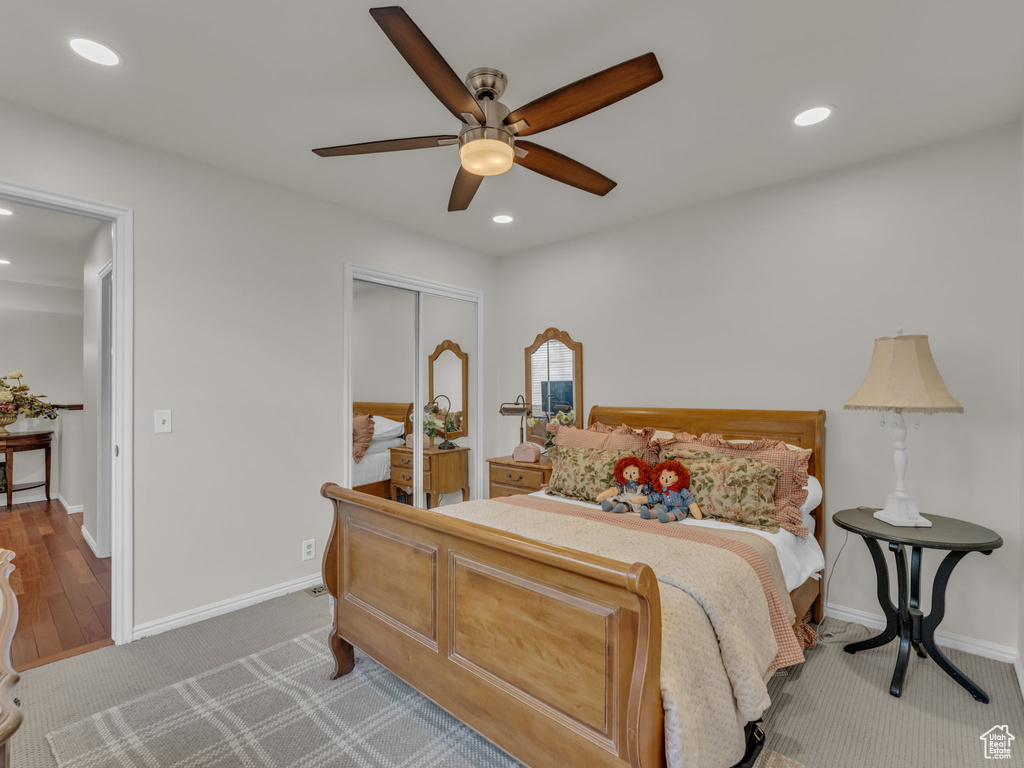 Bedroom with recessed lighting, a closet, a ceiling fan, and carpet flooring