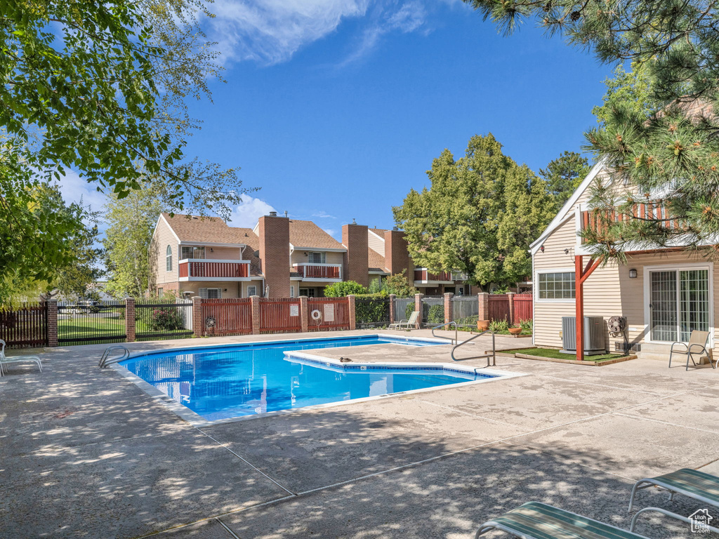 Community pool with a patio area