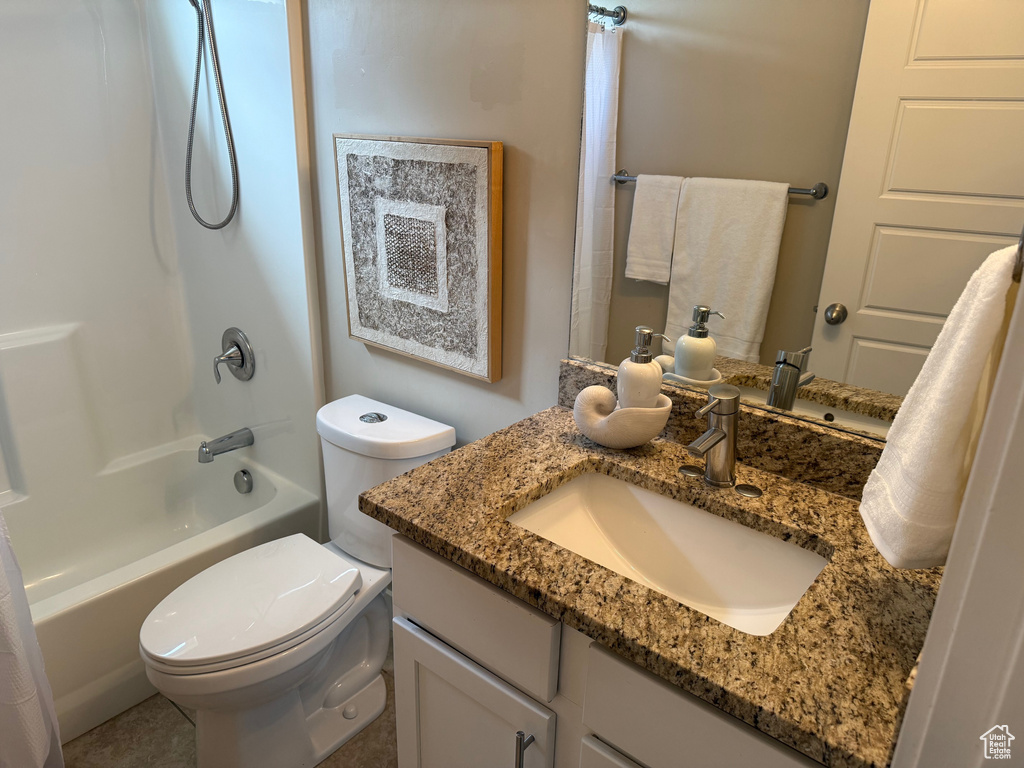 Bathroom with vanity and shower / tub combo