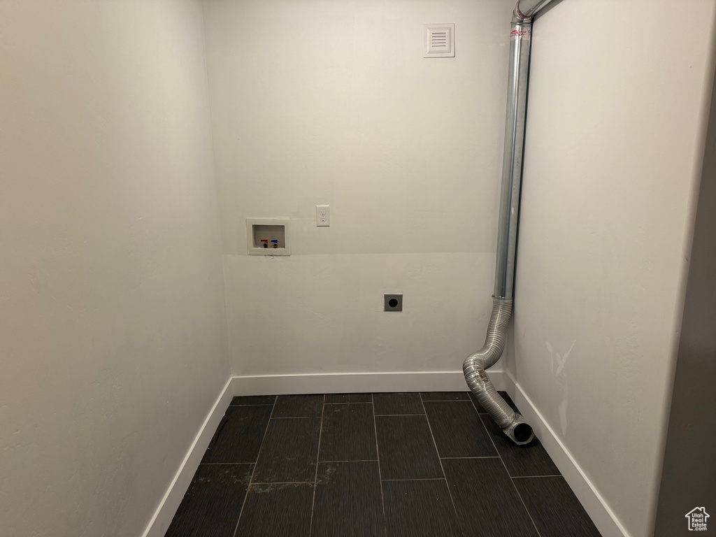 Laundry area featuring hookup for an electric dryer and hookup for a washing machine