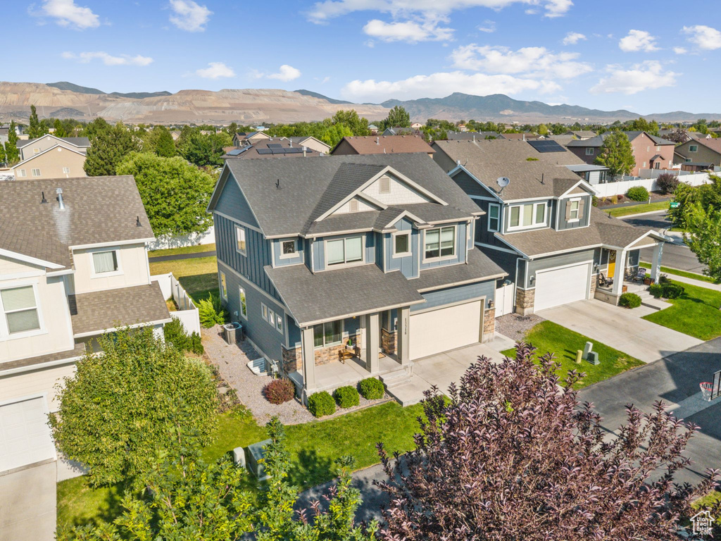 Aerial view of residential area featuring a mountainous background
