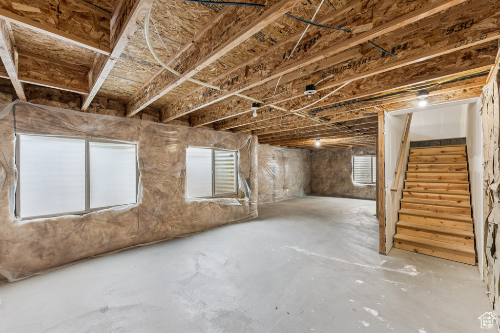 Basement with stairs and plenty of natural light