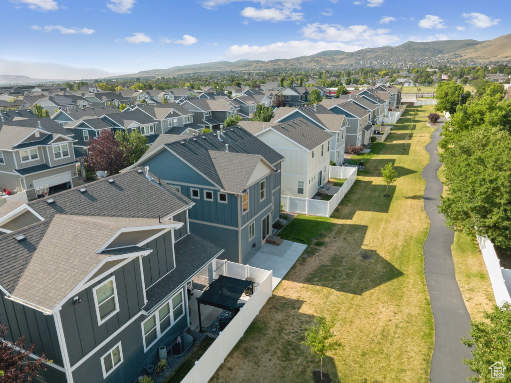 Aerial view of residential area with a mountainous background