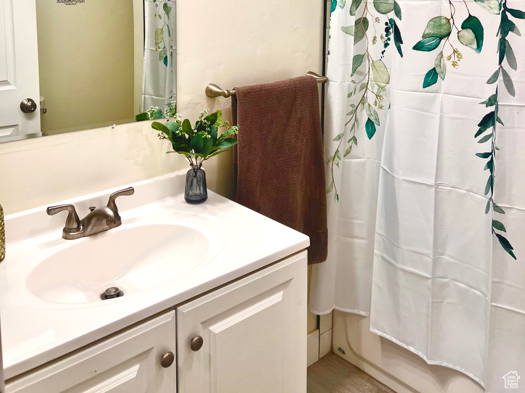 Full bath featuring vanity and a textured ceiling