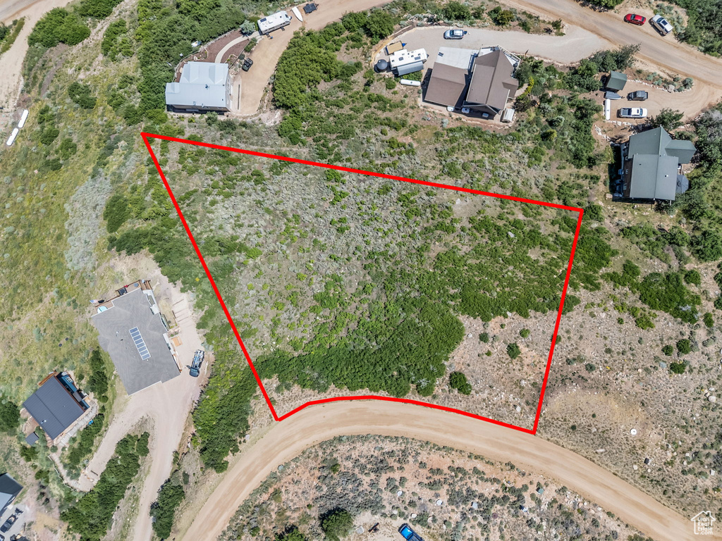 Aerial overview of property\'s location featuring property parcel outlined