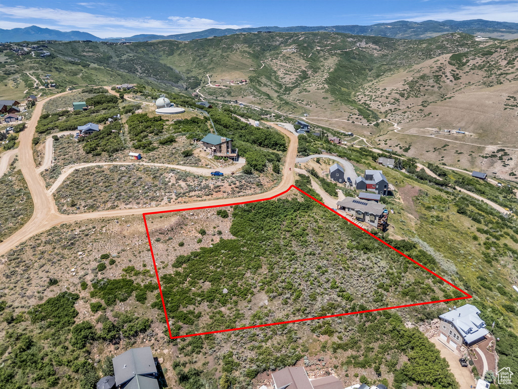 View of property location with property boundaries highlighted and a mountainous background