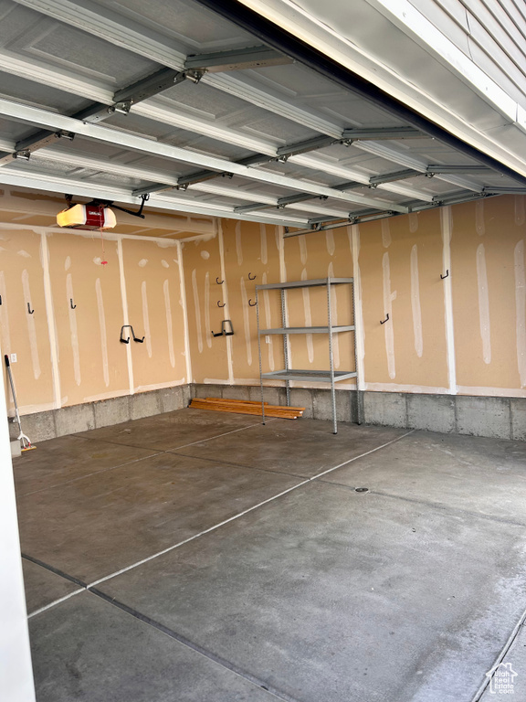 Garage featuring a garage door opener