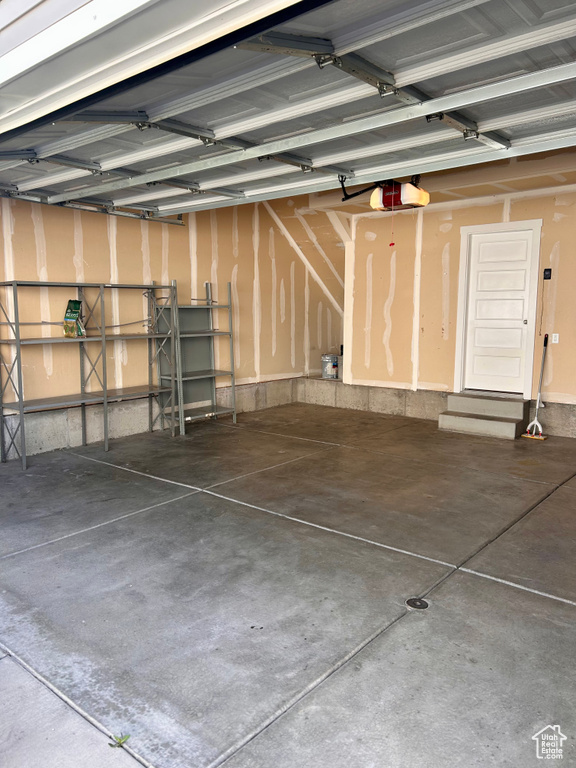 Garage featuring a garage door opener