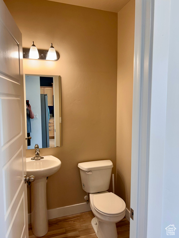 Bathroom featuring wood finished floors